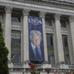 A banner with President Trump's face reading USDA: Growing America since 1852