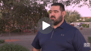 Steve Gomez is interviewed in a parking lot