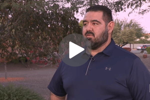 Steve Gomez is interviewed in a parking lot