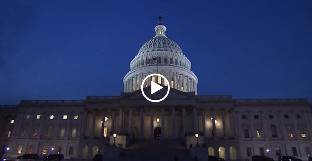 The U.S. Capitol with a play button overlaid