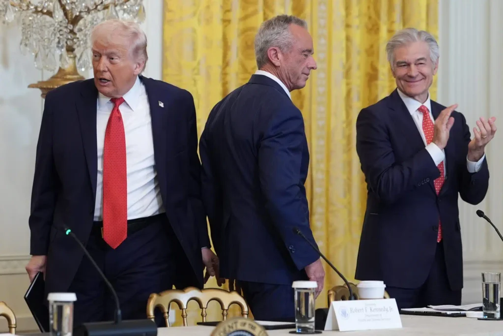President Donald Trump arrives to an event to promote investment in rural health care in the East Room of the White House, Friday, Jan. 16, 2026, in Washington. Standing with the President are Secretary of Health and Human Services, Robert F. Kennedy, Jr., and Mehmet Oz, Administrator for the Centers for Medicare & Medicaid Services. (AP Photo/Evan Vucci)