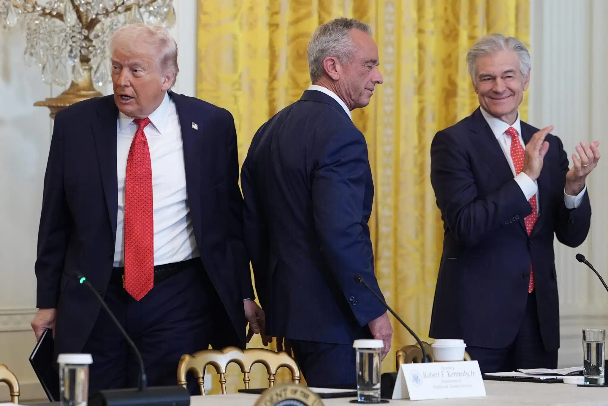 President Donald Trump arrives to an event to promote investment in rural health care in the East Room of the White House, Friday, Jan. 16, 2026, in Washington. Standing with the President are Secretary of Health and Human Services, Robert F. Kennedy, Jr., and Mehmet Oz, Administrator for the Centers for Medicare & Medicaid Services. (AP Photo/Evan Vucci)