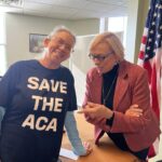 Kennebunk resident Rachel Phipps, here pictured with Gov. Janet Mills, is forgoing health insurance due to spiking costs. (Photo by Eesha Pendharkar/ Maine Morning Star)